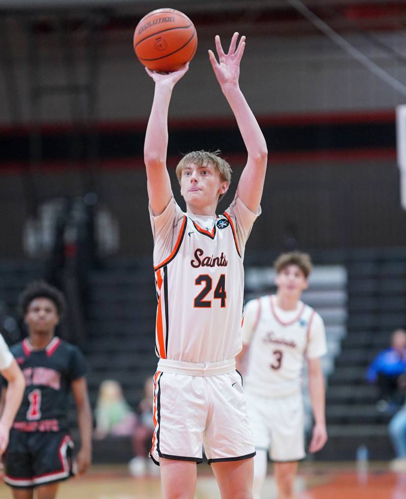 St. Charles East's Andrew Wolfsmith (24) shoots a free throw during the 64th annual Ron Johnson Thanksgiving Basketball Tournament at St. Charles East High School on Monday, Nov 20, 2023.