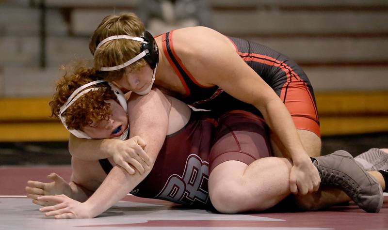 Huntley’s Max Dziamidau tries to turn Prairie   Ridge’s Logan Bodine during the 215-pound match of a Fox Valley Conference boys wrestling meet on Thursday, Jan. 22, 2026, at Prairie Ridge High School Crystal Lake.