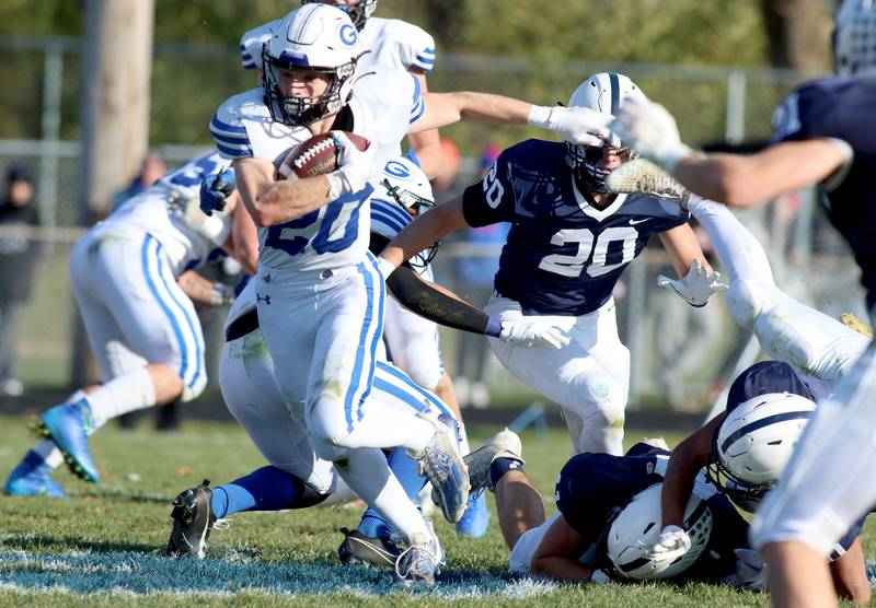 Geneva’s Michael Rumoro runs the ball in IHSA Class 6A quarterfinal playoff football action at Cary Saturday.