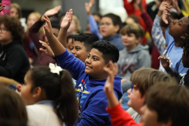 Kankakee student Izrael Esparza Sintora raises his hand during the Impossible Science event at the Kankakee First Church of the Nazarene on May 5, 2026.