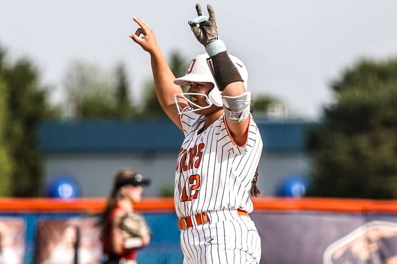 Oswego’s Aubriella Garza (12) celebrates after hitting a double against Yorkville during a softball game at Oswego High School on Thursday, May 15, 2025.