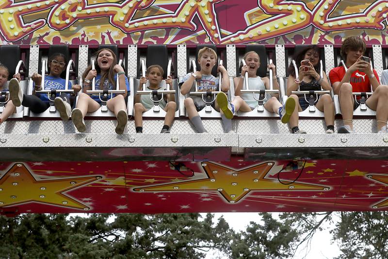 Kids react as the ride on the Rock Star ride during Lakeside Festival Friday, June 30, 2023, at the Dole and Lakeside Arts Park in Crystal Lake.