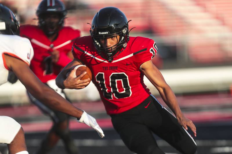 Bolingbrook receiver Bobby Ervin sneaks for a first down on Friday, Sept. 10, 2021, at Bolingbrook High School in Bolingbrook, Ill.