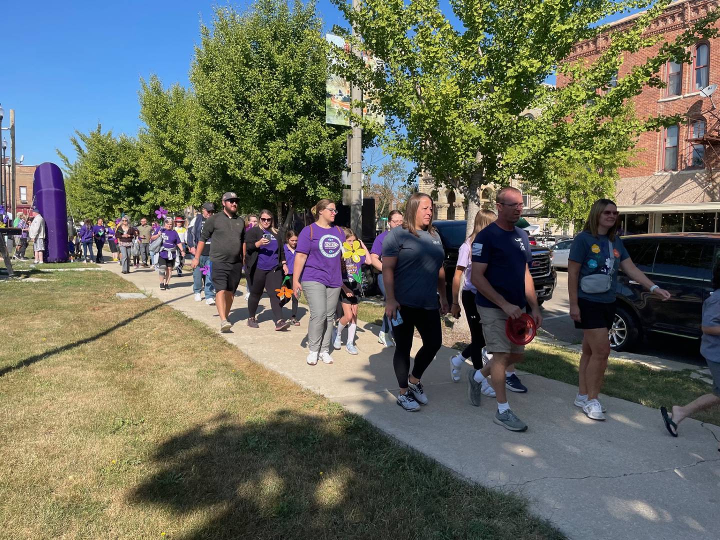 Dozens of purple-clad walkers set off Saturday, Sept. 9, 2023, from Ottawa's Jordan block on the 2023 Walk to End Alzheimer’s. Organizers expressed confidence the annual event would meet the fundraising goal of $40,000.