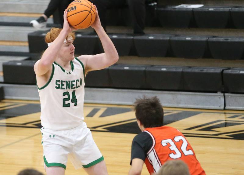 Seneca's Wyatt Holman looks to pass the ball around Roanoke-Benson's Jonah Sauder during the Tri-County Conference Tournament on Tuesday, Jan. 27, 2026 at Putnam County High Schooo.