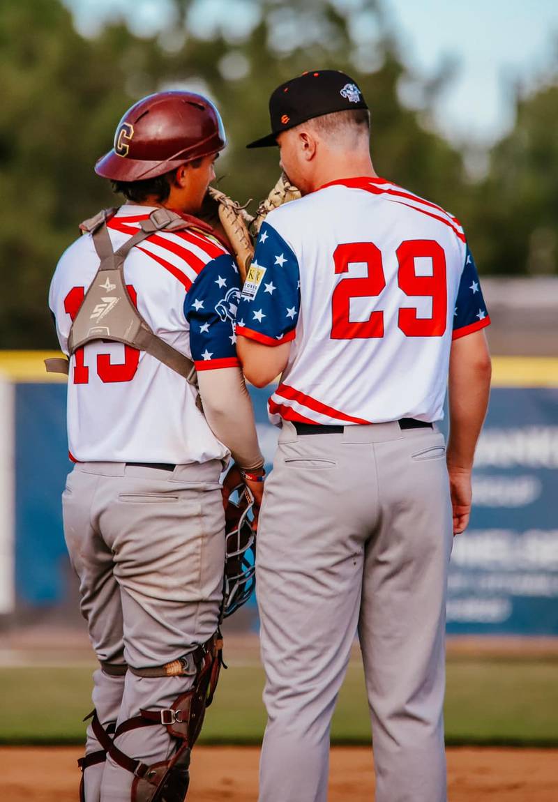 Illinois Valley catcher Brandon Mahler (left) talks to pitcher Andrew Ressler during the Pistol Shrimp's 7-5 loss to the Danville Dans on Wednesday, July 3, 2024 at Schweickert Stadium in Peru.
