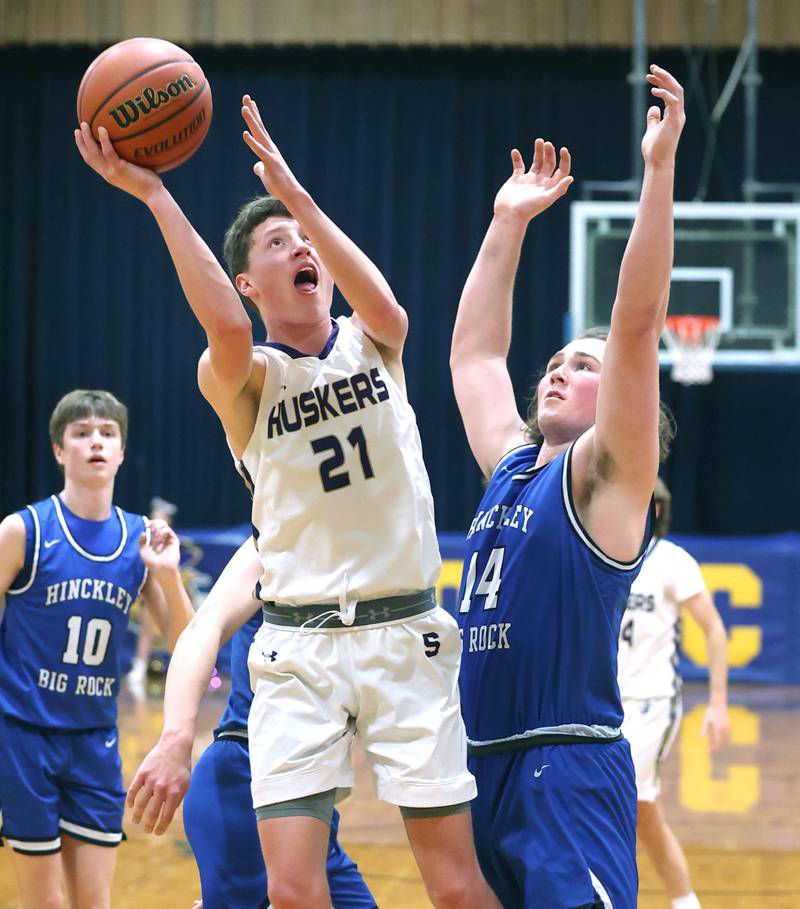 Serena's Braxton Hart shoots over Hinckley-Big Rock's Martin Ledbetter Friday, Feb. 3, 2023, during the championship game of the Little 10 Conference Basketball Tournament at Somonauk High School.