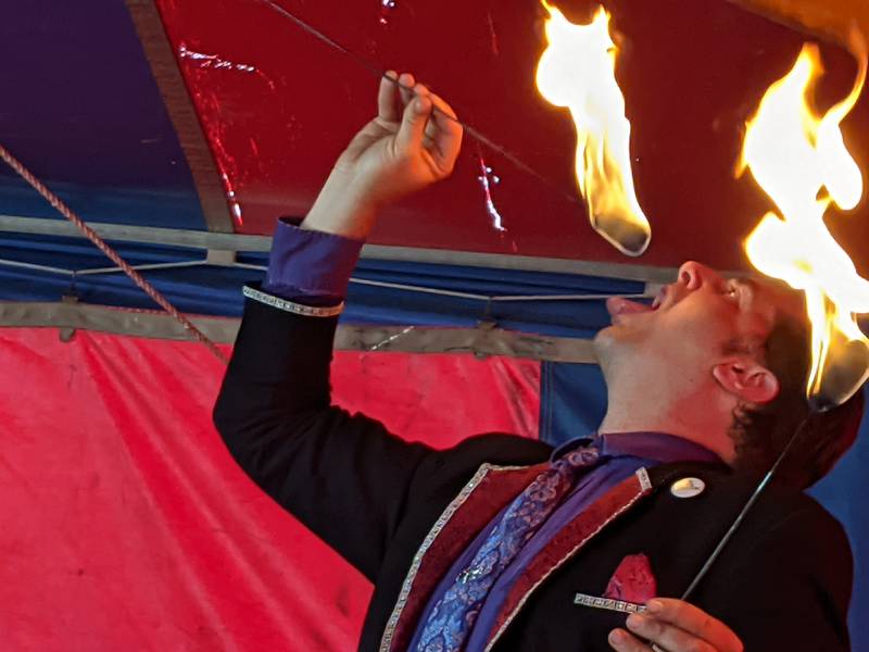 Tommy Breen shows off his fire eating skills as part of the World of Wonders show on Sunday at the Kane County Fair.