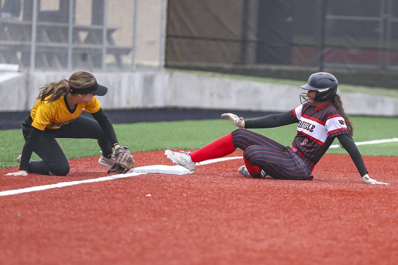 Yorkville's Liv Lathen (5) slides into third during softball game between Joliet West at Yorkville on Wednesday, April 30, 2025 in Yorkville.
