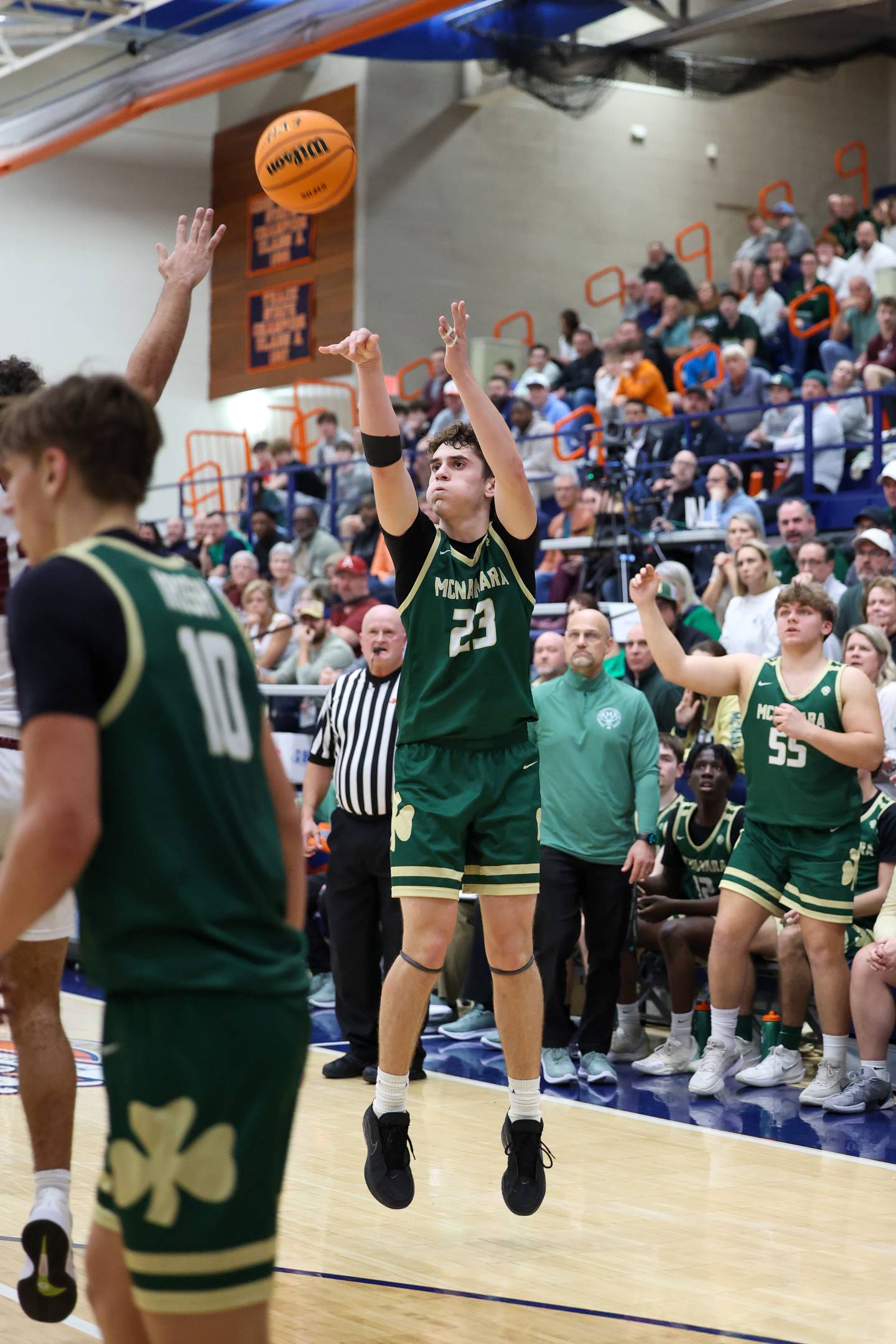 Bishop McNamara's Karter Krutsinger shoots a 3-pointer during the Fightin' Irish's 77-70 loss to Tolono Unity in the IHSA Class 2A Pontiac Supersectional on Monday, March 9, 2026.