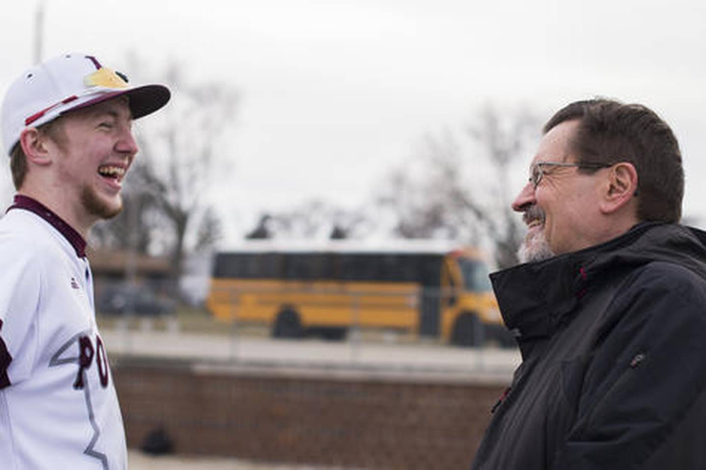 Joliet Herald News sports reporter Dick Goss shares a laugh with Lockport's CJ Weins Saturday, March 31, 2018, at Ed Flink Field in Lockport, Ill.