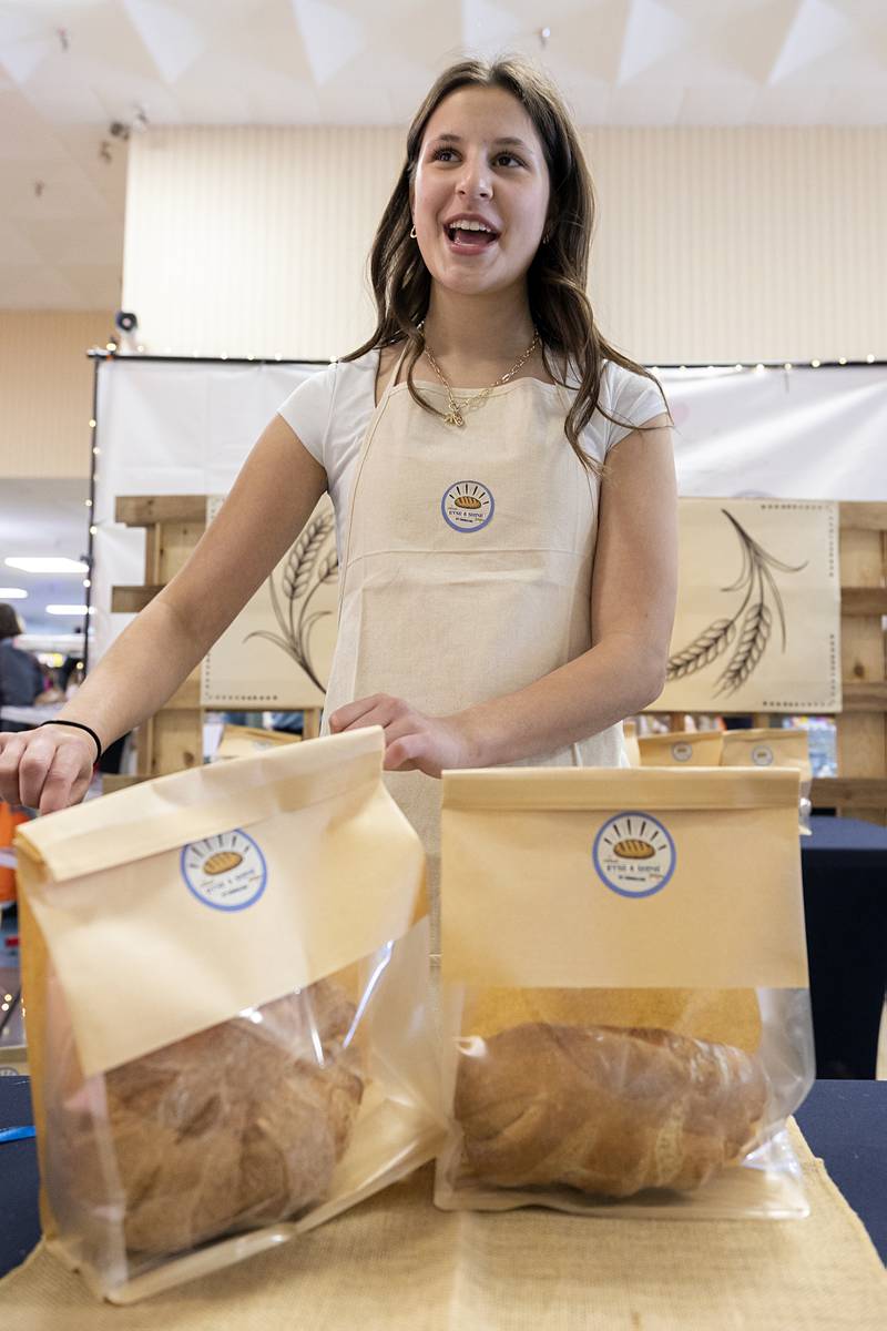 Ryse and Shine baker Emmaline Burger of Newman High School talks about her artisanal bread for sale Wednesday, April 29, 2026, at the WACC CEO class trade show. Burger taught herself to bake for her product.