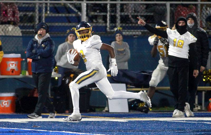 Sterling’s Kaedon Phillips carries the ball for a touchdown during a Class 5A first-round game against St. Francis on Friday, Nov. 1, 2024 in Wheaton.
