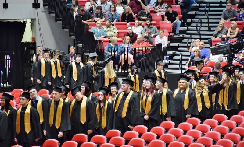 Sycamore High School process into the commencement ceremony for the Class of 2022. The commencement was held Sunday, May 22, 2022 at Northern Illinois University's Convocation Center in DeKalb.