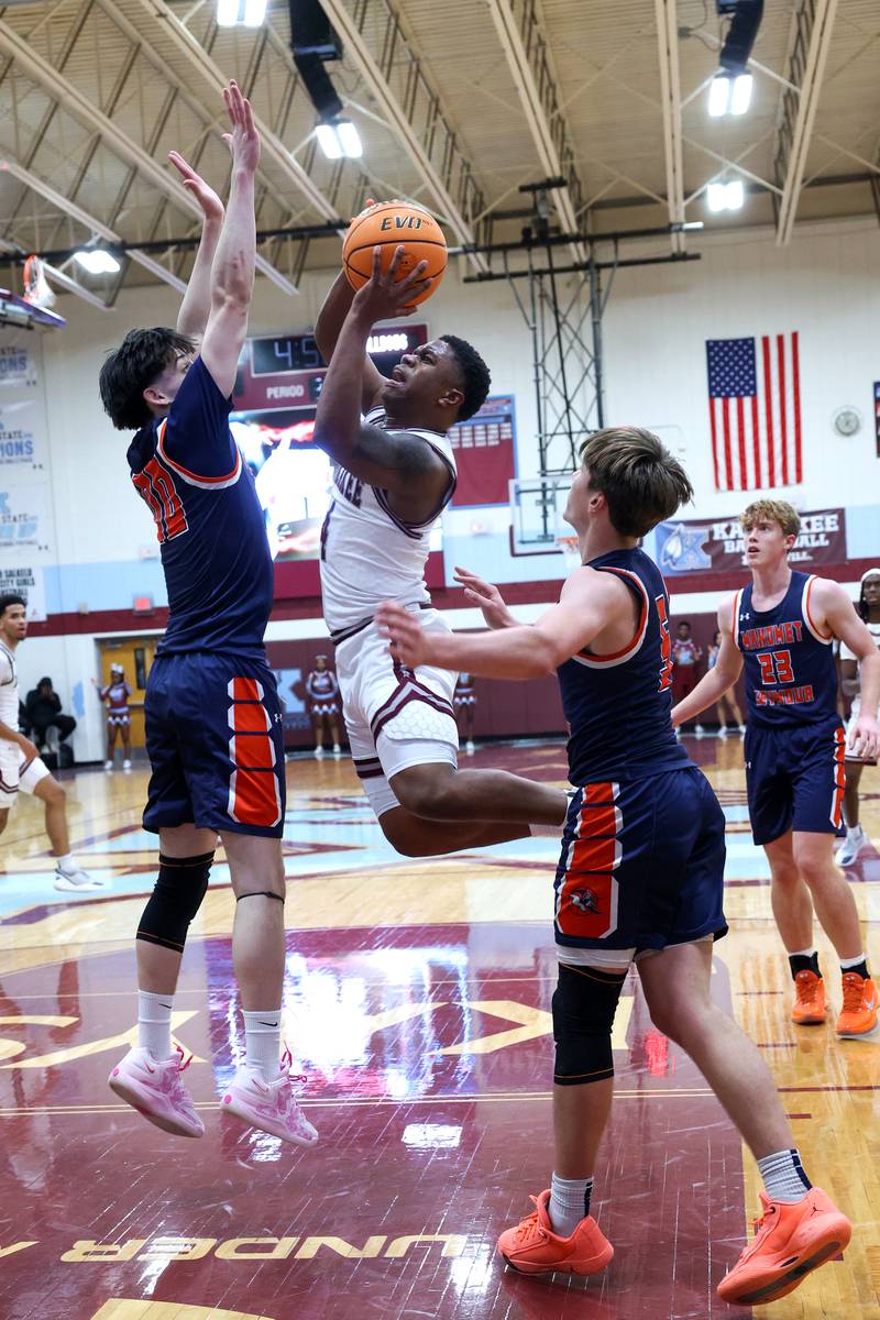 Kankakee's Myair Thompson maneuvers around a defender during the Kays' 74-60 victory over Mahomet-Seymour on Tuesday, Dec. 2, 2025.