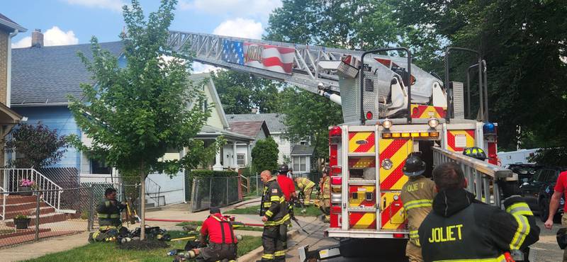 Joliet firefighters extinguish a fire at a house in the 400 block of Ohio Street on Friday afternoon. July 12, 2024
