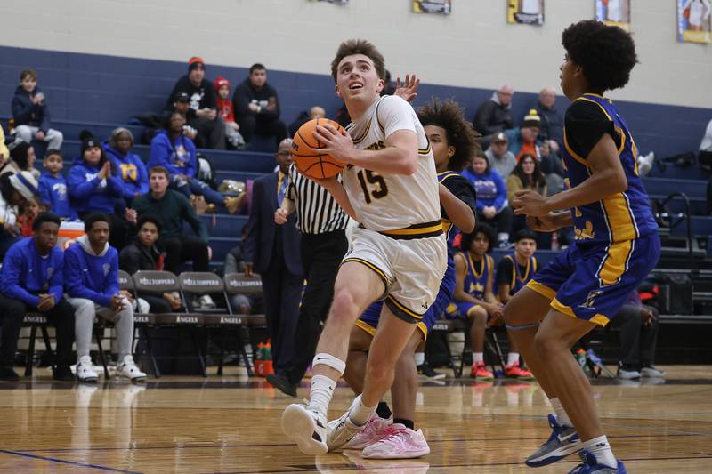 Joliet Catholic’s Brady Tunkel works under the basket against Joliet Central on Tuesday, Jan 20, 2026 in Joliet.