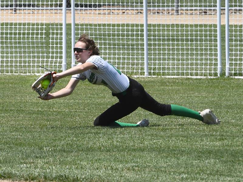Rock Falls centerfielder Madisyn Eikenberry dives for a line drive against Oregon during the championship game of the 2A Oregon Regional on Saturday, May 23, 2026 at Oregon Park West.