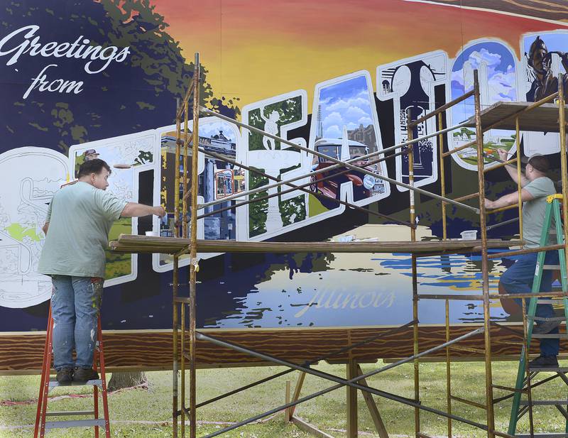 The “Greetings From Streator” mural was created during the annual Pluto Fest Saturday at Streator’s City Park. The mural will be added to and be part of the Walldogs mural collection throughout the city.