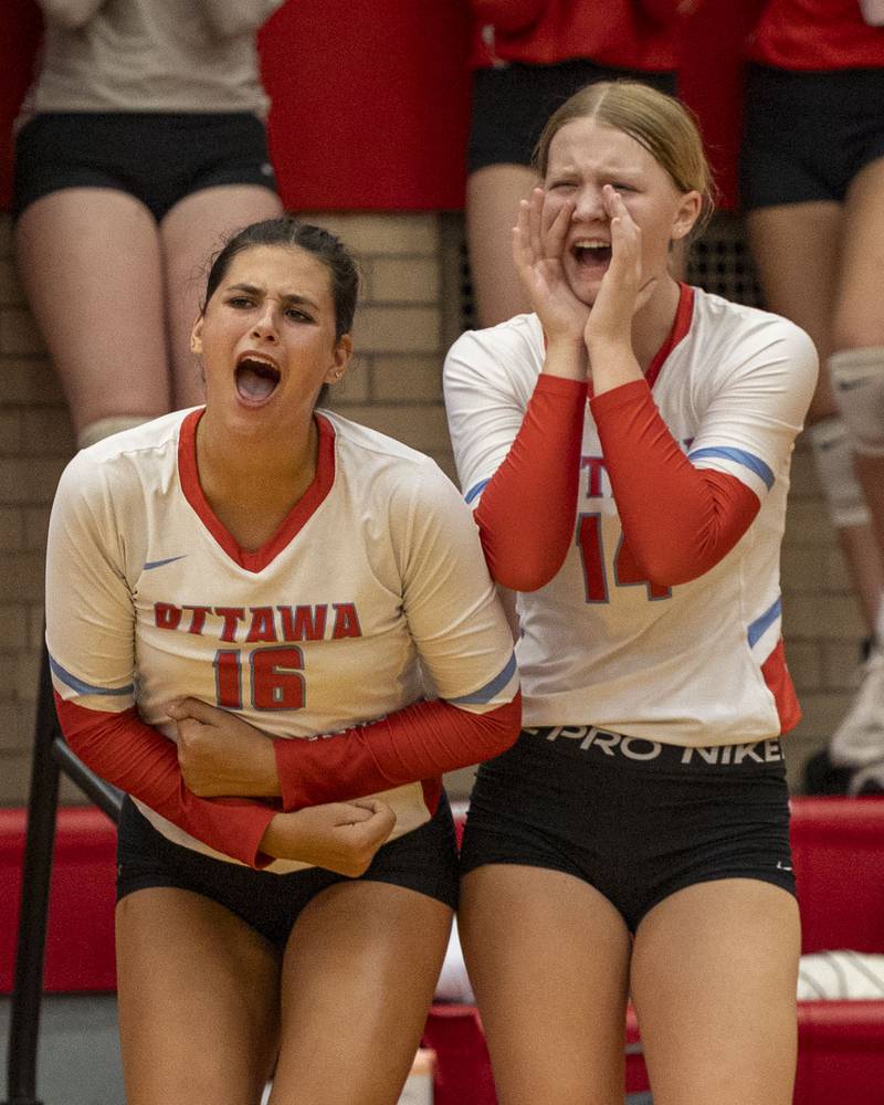 (from left) Bella Knoll (16) of Ottawa and teammate Libby Muffler (14) celebrate team scoring on Thursday, Sept. 18, 2025 at Ottawa High School in Ottawa.