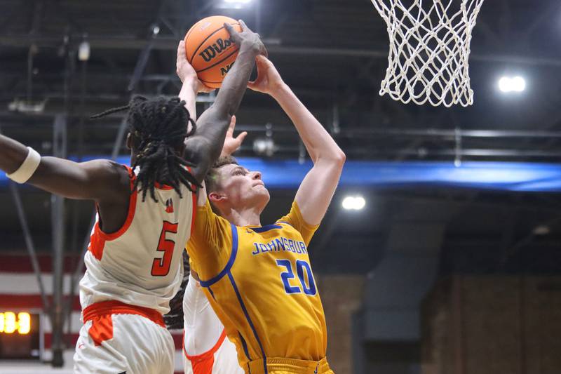 Johnsburg’s Josh Kaunas works under the hoop against Peoria Manual in boys IHSA Class 2A Supersectional basketball on Monday, Mar. 9, 2026, at Sterling High School in Sterling.