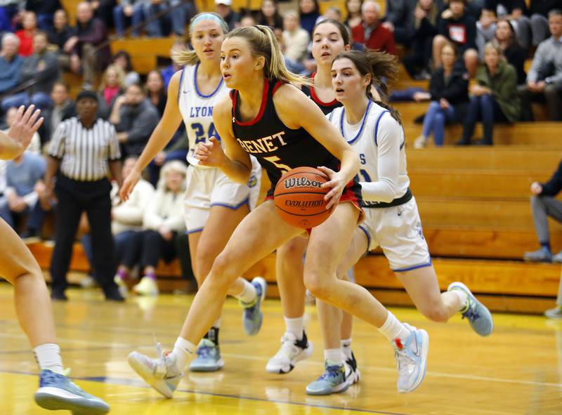 Benet's Lenee Beaumont (5) drives the ball during the girls varsity basketball game between Benet Academy and Lyons Township on Wednesday, Nov. 30, 2022 in LaGrange, IL.