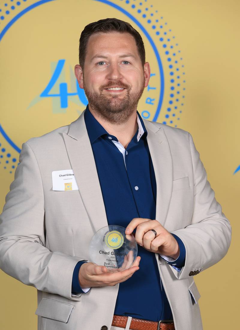 Chad Gilbreth poses with his 40 Under Forty award during the Illinois Valley Chamber of Commerce Champions of Change Awards Night on Thursday, April 10, 2025 at the Westclox Event Center in Peru.