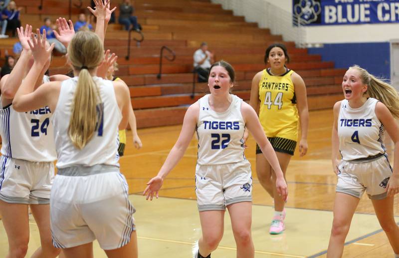 Princeton players Keighley Davis, Payton Brandt, Camryn Driscoll and Paige Jesse reacts after Brandt scored a basket against Putnam County during the Princeton Holiday Girls Basketball Tournament on Tuesday, Nov. 19, 2024 at Princeton High School.
