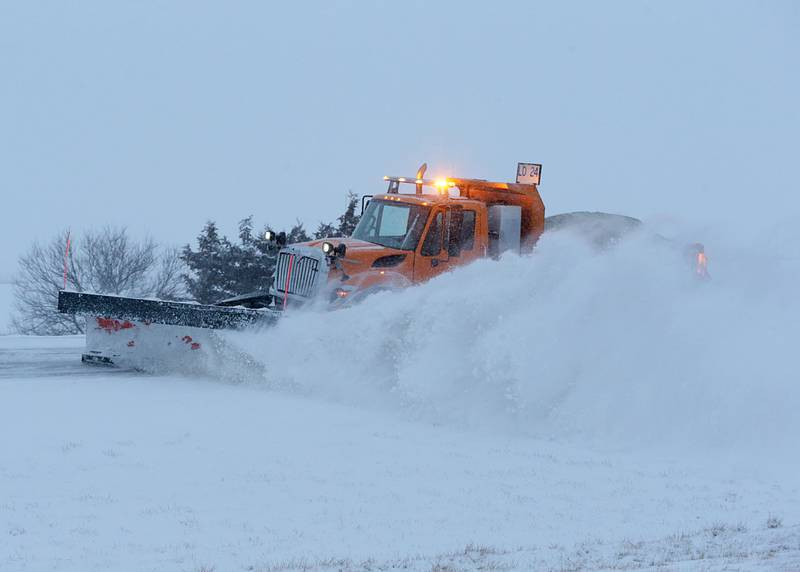A snow plow pushes snow off of the on-ramp to Interstate 80 near the Interstate 180 interchange on Wednesday, Feb. 2, 2022, near Princeton.