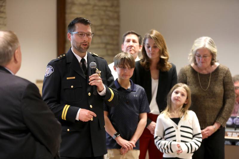 Eric Blowers, surrounded by his family, is sworn in as Batavia Police Chief on Monday, Jan. 6, 2025 by Batavia Mayor Jeffery Schielke during a city council meeting.