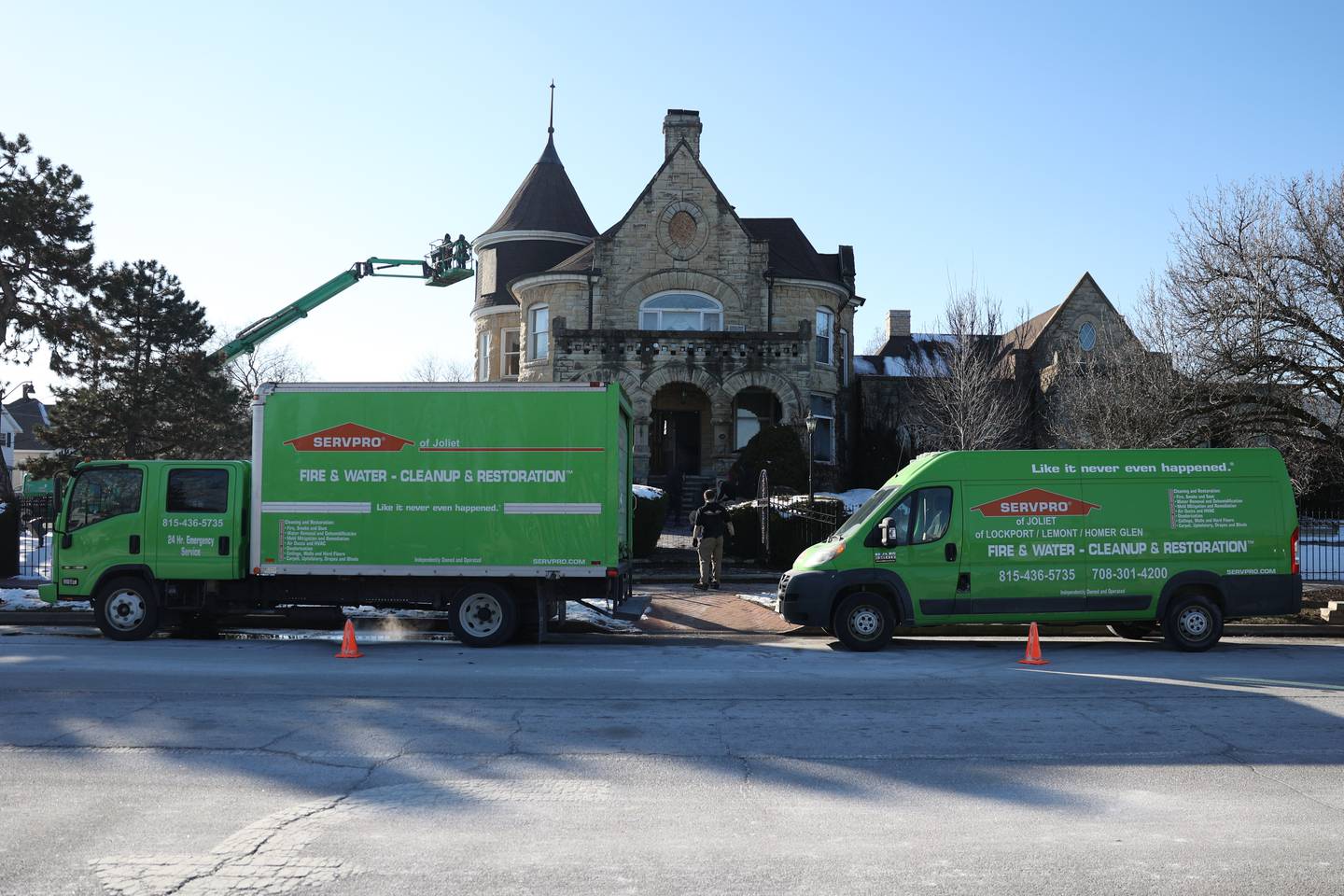 A cleanup and restoration company works at the Haley Mansion that was damaged by a fire on Wednesday evening.