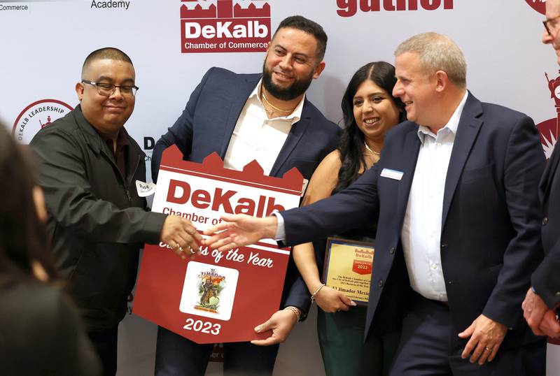 Rudy Jernadez, (left) Christopher Cardenas and Olivia Pacheco from El Jimador Mexican Grill accept congratulations from DeKalb City Manager Bill Nicklas after being named as the 2023 Business of the Year Thursday, Feb. 8, 2024, during the DeKalb Chamber of Commerce’s Annual Celebration Dinner in the Barsema Alumni and Visitors Center at Northern Illinois University.