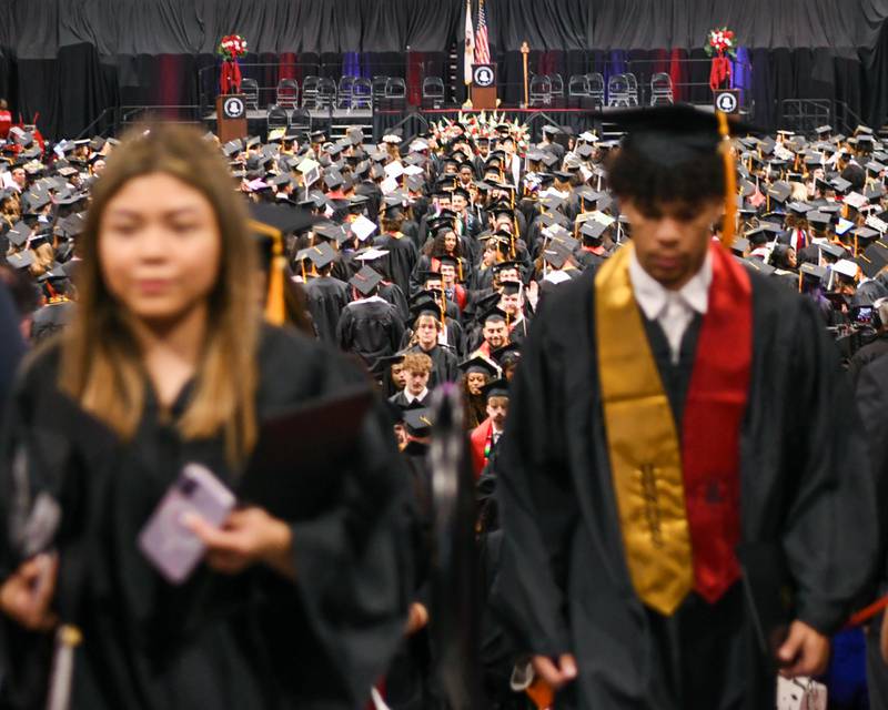 Northern Illinois University graduates file out of the Convocation Center in DeKalb to meet up with friends and family on Saturday May 9, 2026, after the graduation ceremony was completed.