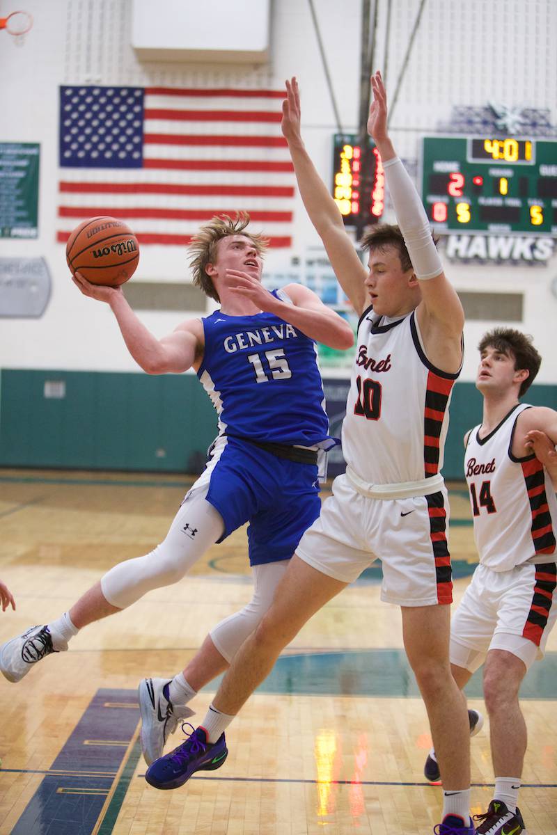Geneva's Jimmy Rasmussen drives to the basket against Benet's Andy Nashat the Class 4A Sectional Final at Bartlett on Friday, March 3, 2023.