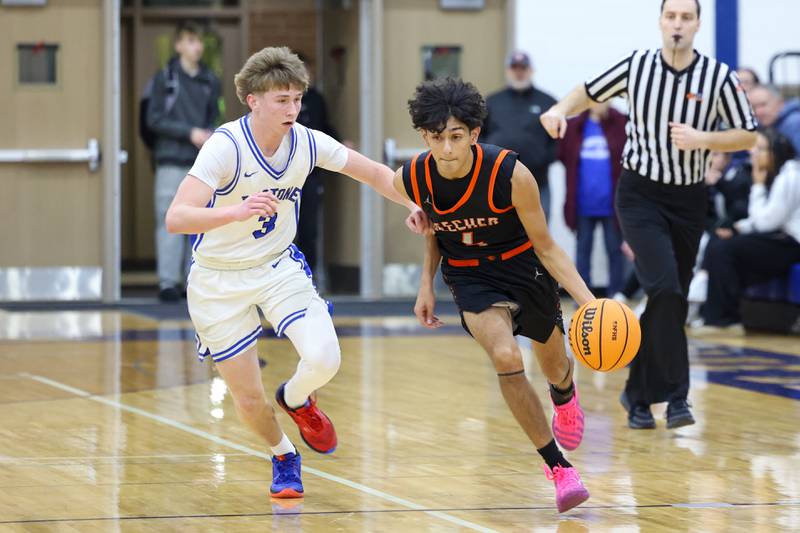 Beecher's Wences Baumgartner brings the ball up against Peotone's Nick Cronin during the Blue Devils' 64-52 victory over Beecher on Wednesday, Jan. 28, 2026.