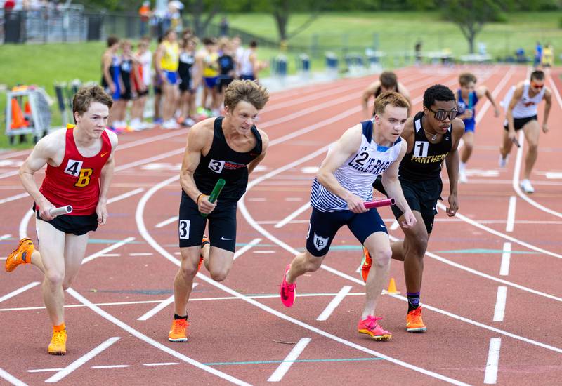 The varsity 4x800 race begins during the Dukane Conference Boys Track and Field Meet hosted by Lake Park High School in Roselle on Friday, May 16, 2025.