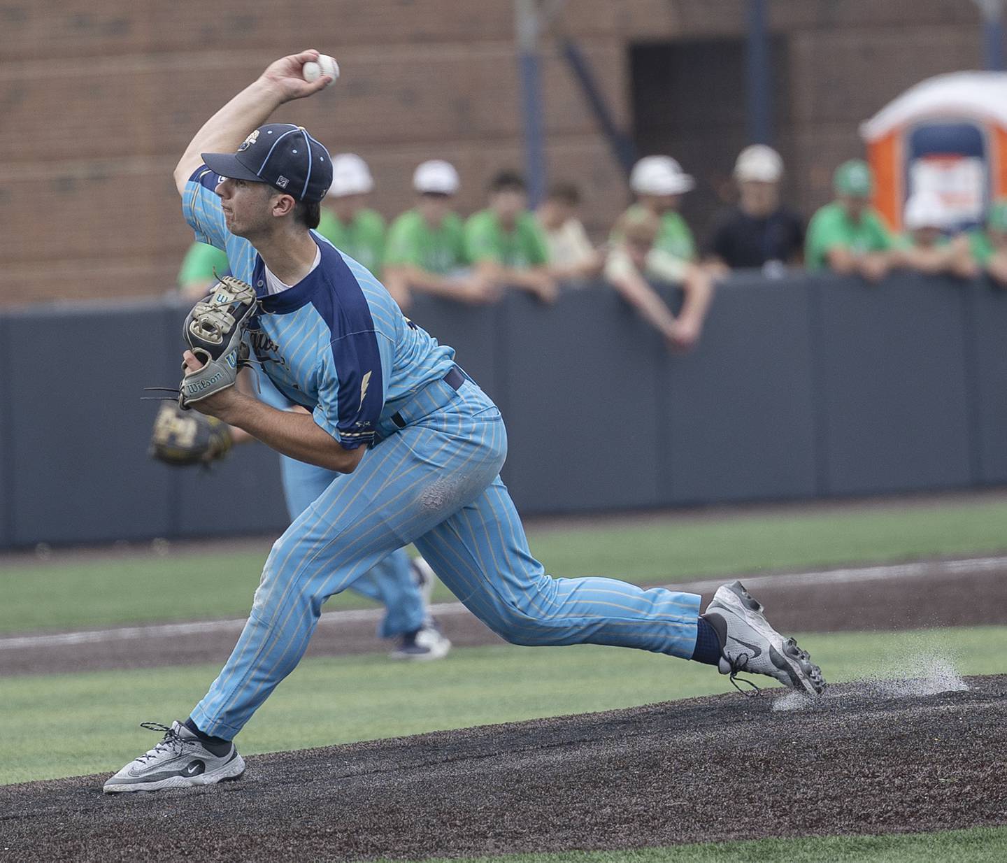 Ottawa Marquette’s Alec Novotney fires a pitch against Father McGivney Saturday, June 7, 2025, during the Class 1A state baseball final at Illinois Field in Champaign.