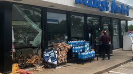 Police: Dixon business damaged when woman crashed car into store window