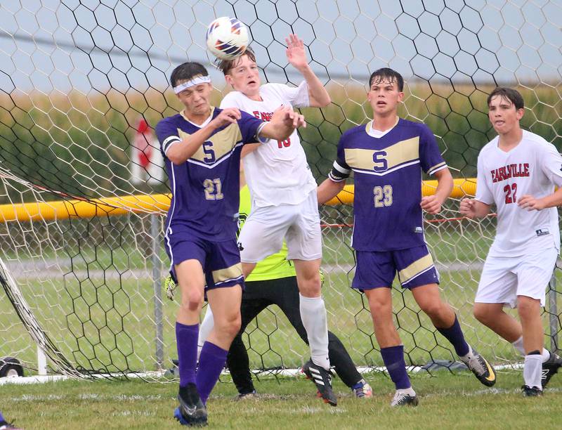 Serena's Nolan Muffler, and Earlville's Jeff Peterson, jump in the air for a header near the goal as Serena's Payton Twait, and Earlville's Rob Tinson, watches from behind on Wednesday, Sept. 3, 2025 at Serena High School.