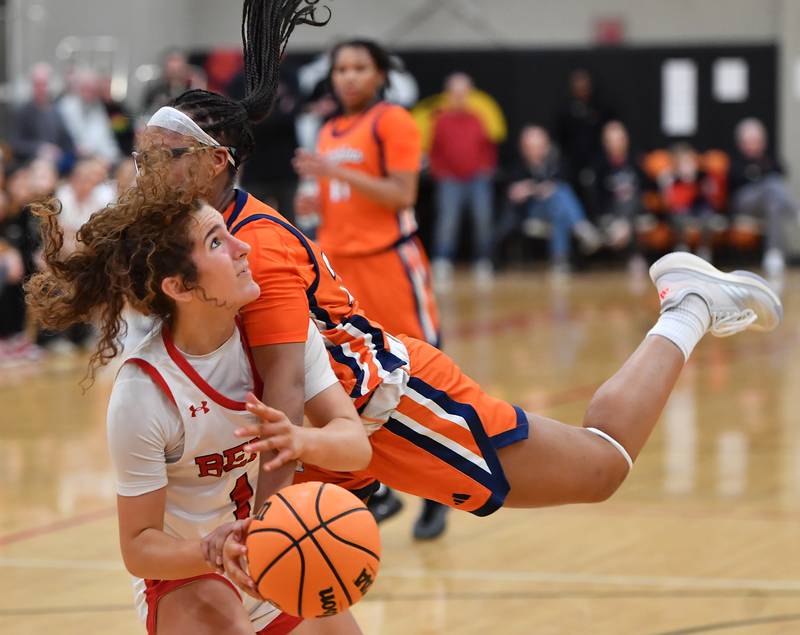 Benet’s Macy Menendez shoulders a massive foul by Whitney Young’s Harmony Cooper that sent both to the floor during a Coach Kipp Hoopsfest game on January 19, 2026 at Benet Academy in Lisle.