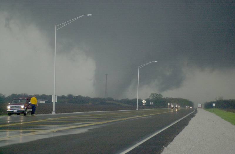 A tornado moves along the Illinios River as it crosses Illinios Route 251 on Tuesday, April 20, 2004 near Illinois Valley Community College in Oglesby. The tornado was headed straight for the Village of Utica.