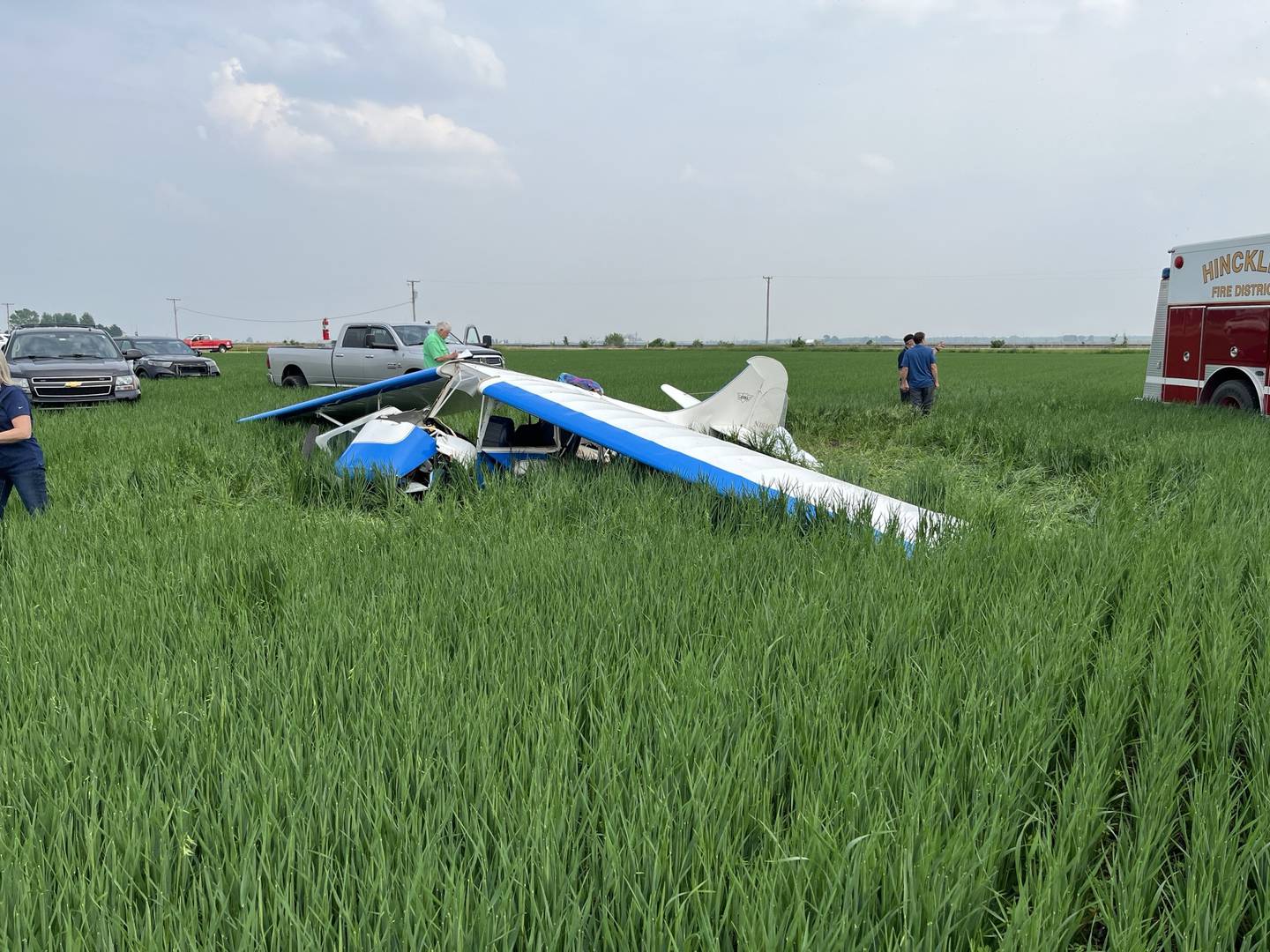The remains of a 1946 Aeronca Champion 7AC single-engine plane lay in a farm field west of Hinckley Airfield on Saturday, June 7, 2025. The crash killed a 51-year-old pilot from Maple Park and injured a 3-year-old passenger, according to the DeKalb County Sheriff's Office.