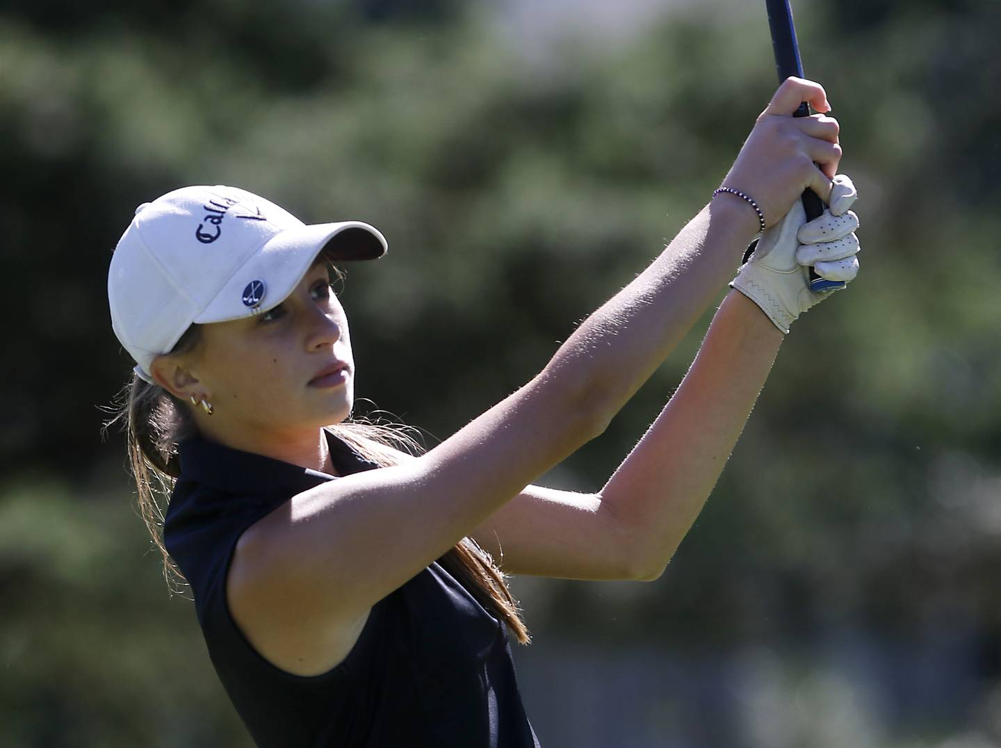 Huntley’s Kinsey Hayes watches her tee shot on the first hole during the IHSA Class 2A Huntley Girls Golf Regional on Tuesday, Oct. 1, 2024, at Pinecrest Golf Club in Huntley.