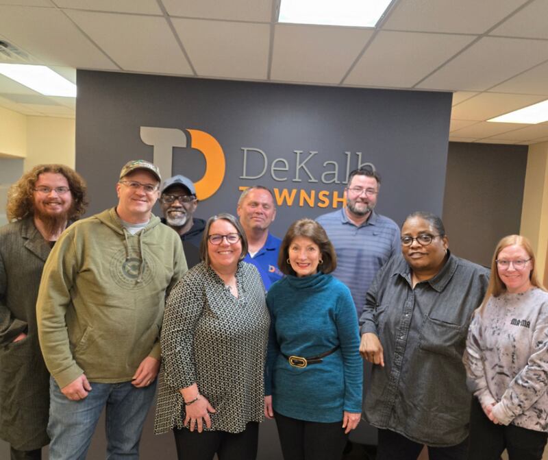 The DeKalb Township recently received a large monetary donation from DeKalb resident Gretchen Moore to expand Oakwood Cemetery’s grounds. (From left): Township Clerk Andrew Tillotson, Township trustee, Chad McNett, trustee Dale Thurman, Township supervisor Mary Hess, Highway Commissioner Craig Smith, donor Gretchen Moore (in blue front row), Township Assessor Rich Dyer, and trustees Lisa King and Nancy Bradlo.