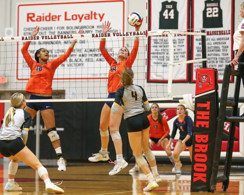 Oswego's Mia Jurkovic (14) blocks a shot during Class 4A Bolingbrook Sectional semifinal match between Joliet West at Oswego.  Nov 5, 2024  in Bolingbrook.