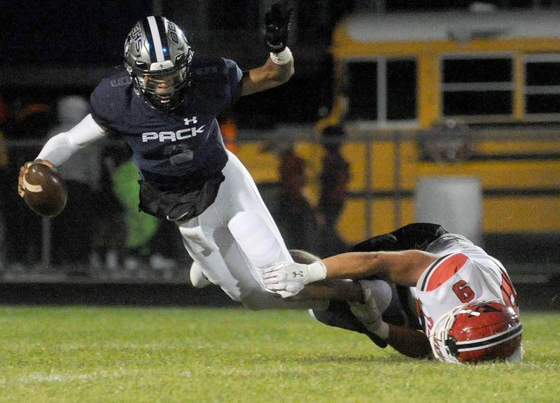 Yorkville defensive lineman Andrew Laurich (9) sacks Oswego East quarterback Robert Tyre Jones III (9) during a varsity football game at Oswego East High School on Friday, Oct. 7, 2022.