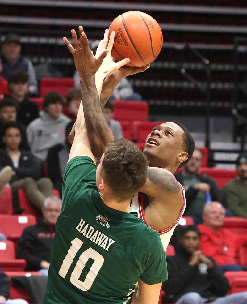 Northern Illinois Huskies guard Zarique Nutter shoots over Ohio Bobcats forward Aidan Hadaway during their game Tuesday, Feb. 7, 2023, in the Convocation Center at NIU in DeKalb.