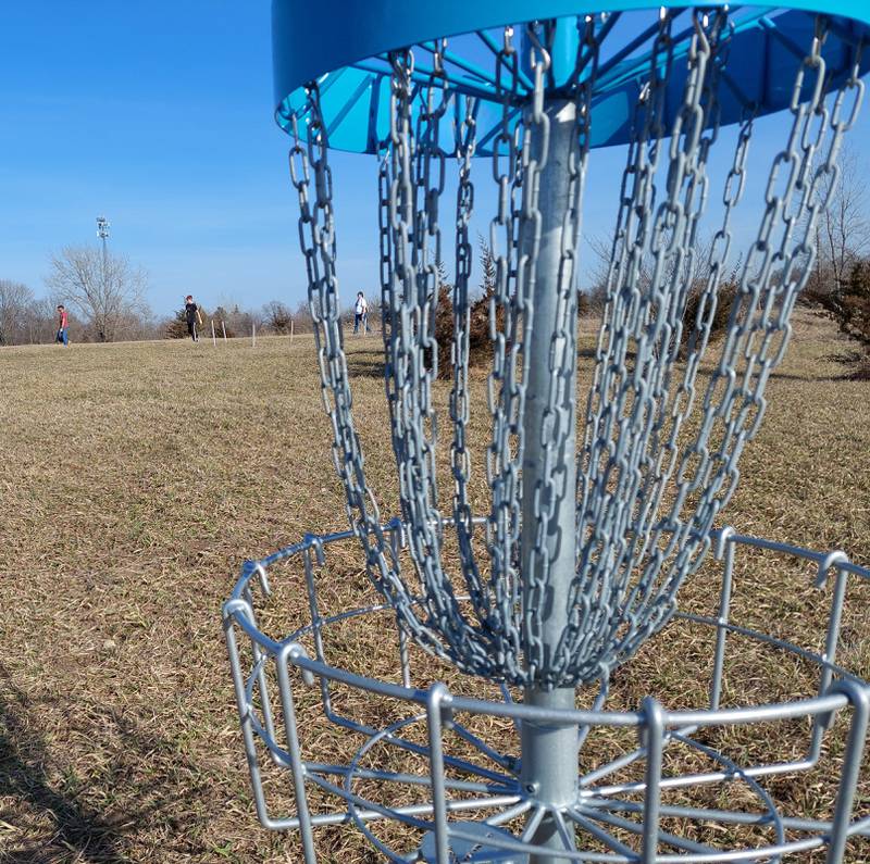 The Washkowiak family plays a round Sunday, March 3, 2024, of disc golf on the new course at Rotary Park in La Salle.