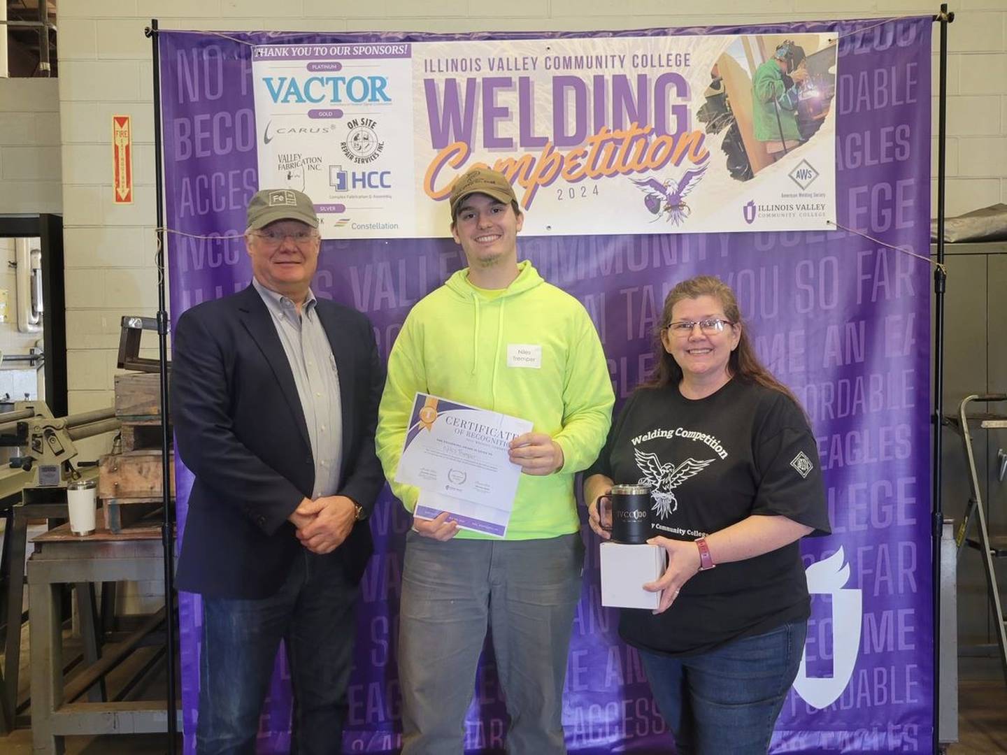Niles Tremper, LaSalle, earned first place and prizes in the high school SMA welding division the IVCC-AWS annual welding competition. He is pictured with Theresa Molln (right) and Ron Ashelford.