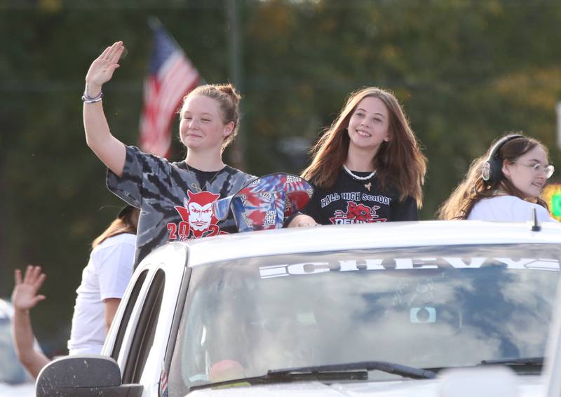 Hall High School welding and power mechanics club wave during the Homecoming parade on Thursday, Sept. 28, 2023 in Spring Valley.